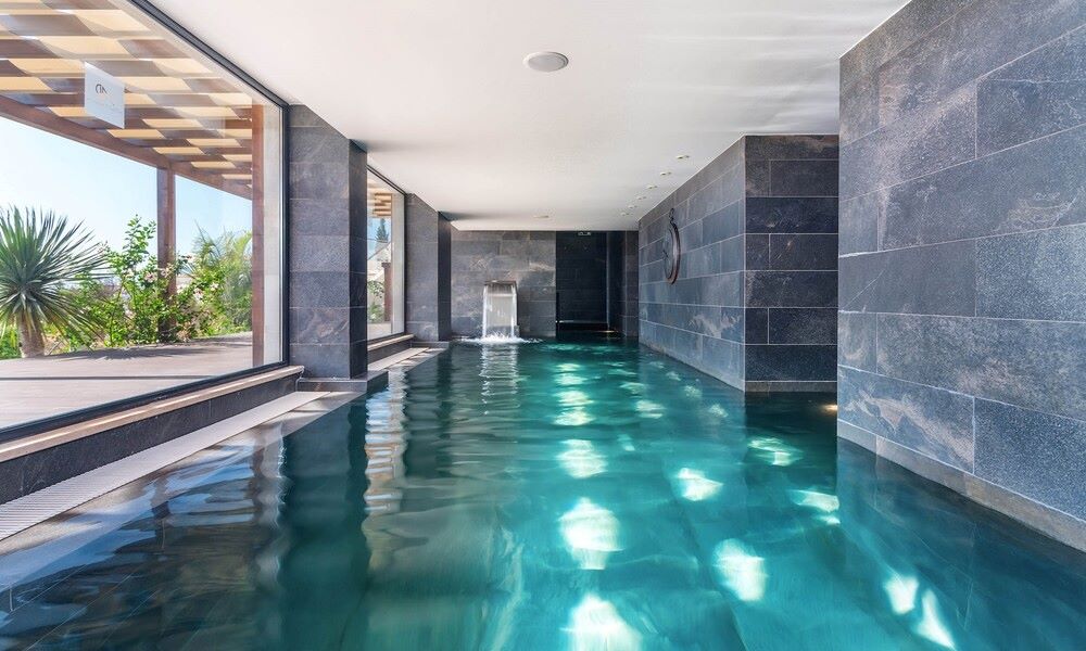 Indoor swimming pool at AP Maria Nova Lounge Hotel