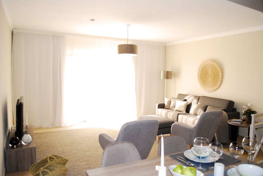 Living room with grey sofa at Pestana Gramacho Residences