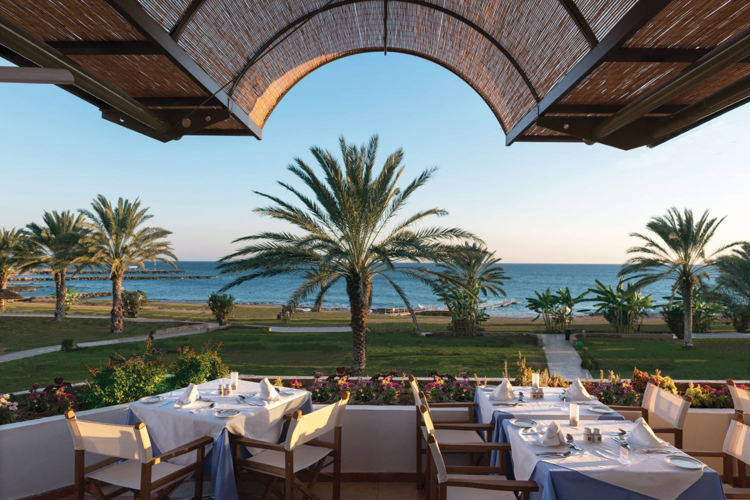 Restaurant looking out to sea at Constantinou Bros Athena Royal Beach Hotel