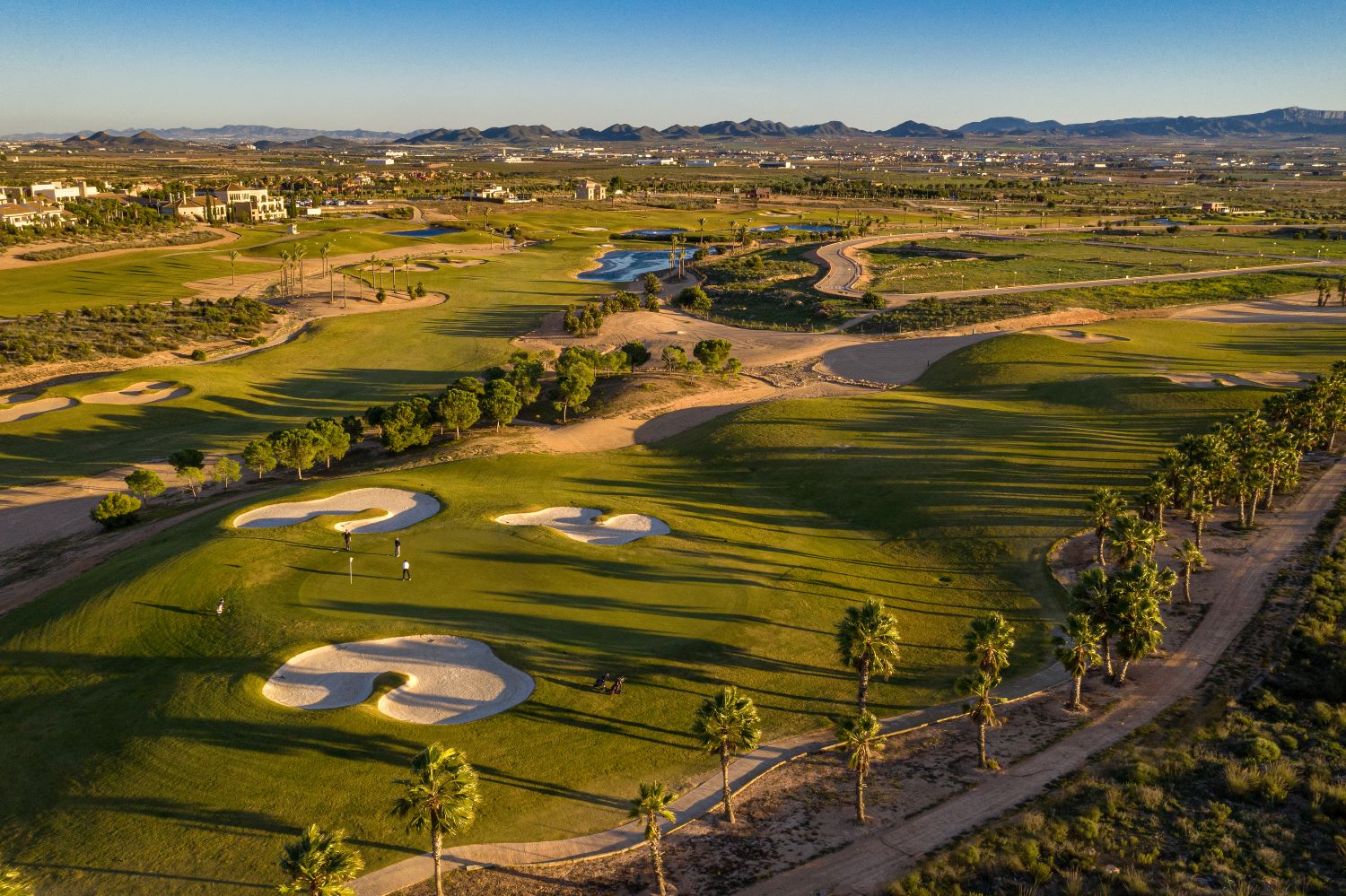 Fairway with trees and bunkers lining the fairways at Hacienda Del Alamo golf course