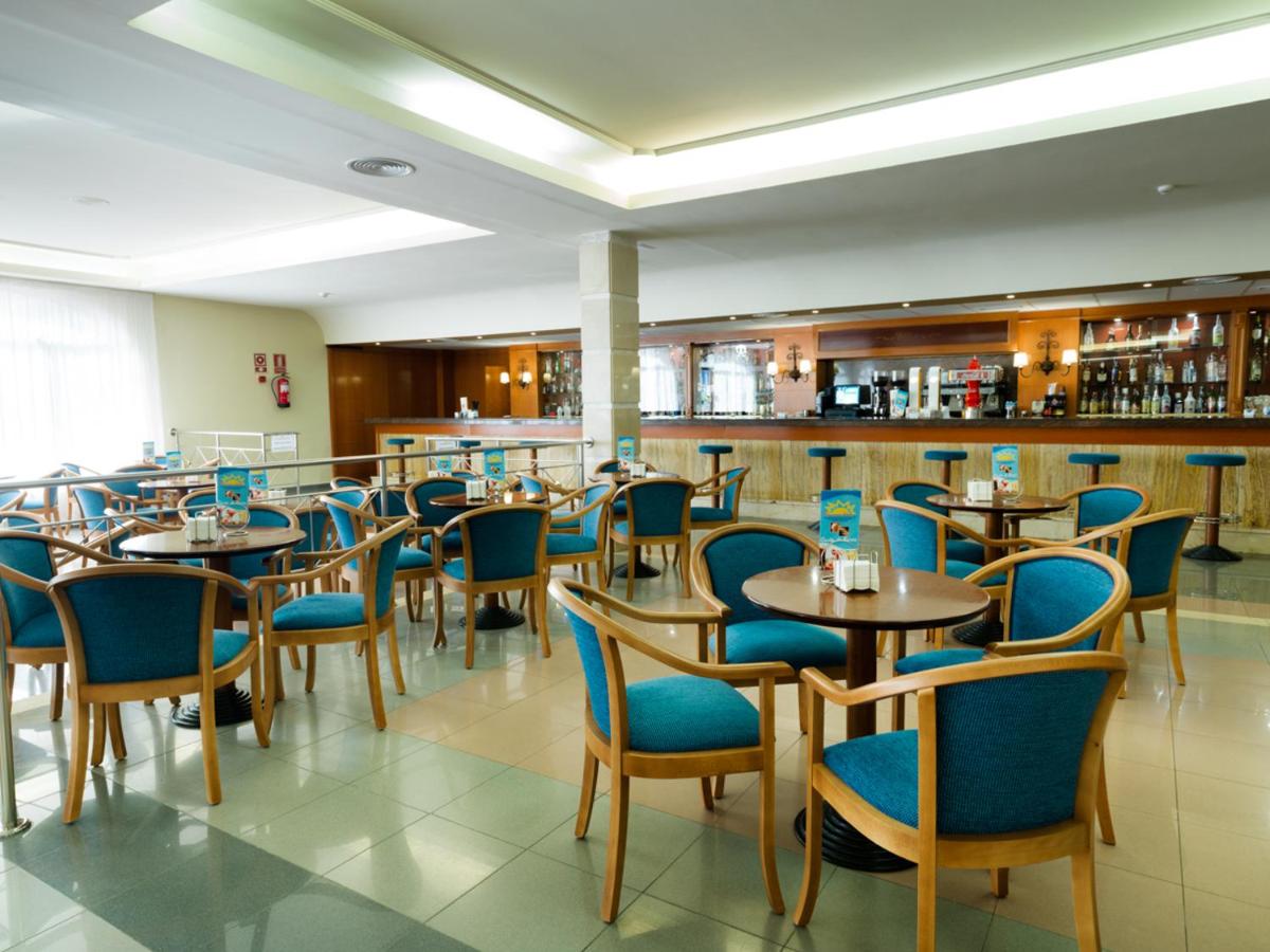 Bar area with tables and chairs at Hotel Monarque Fuengirola Park in Spain's Costa Del Sol