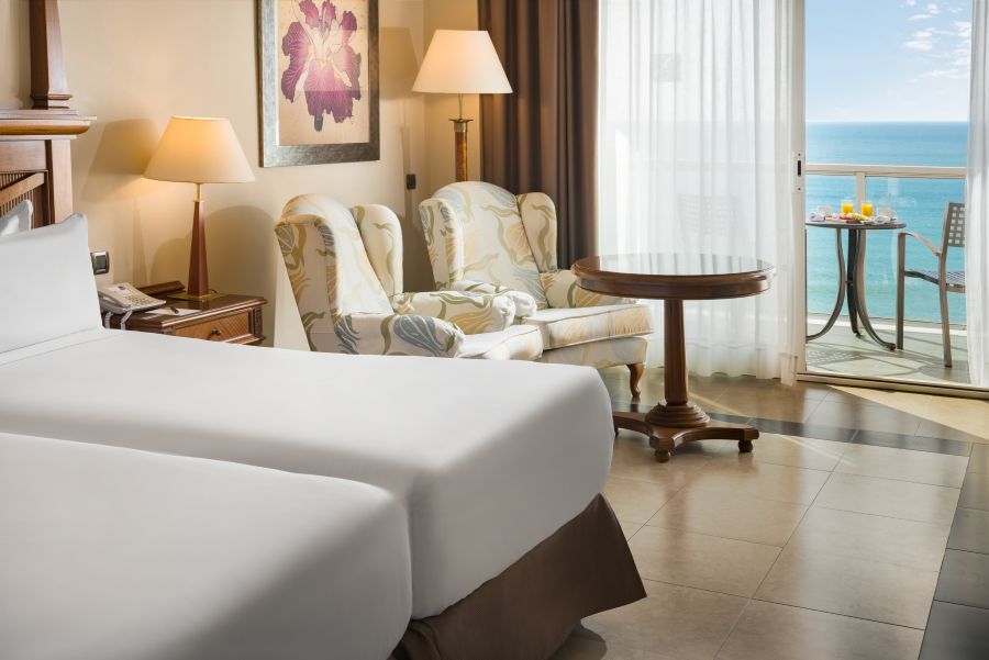 Two chairs and table in superior room at Elba Estepona Gran Hotel & Thalasso Spa