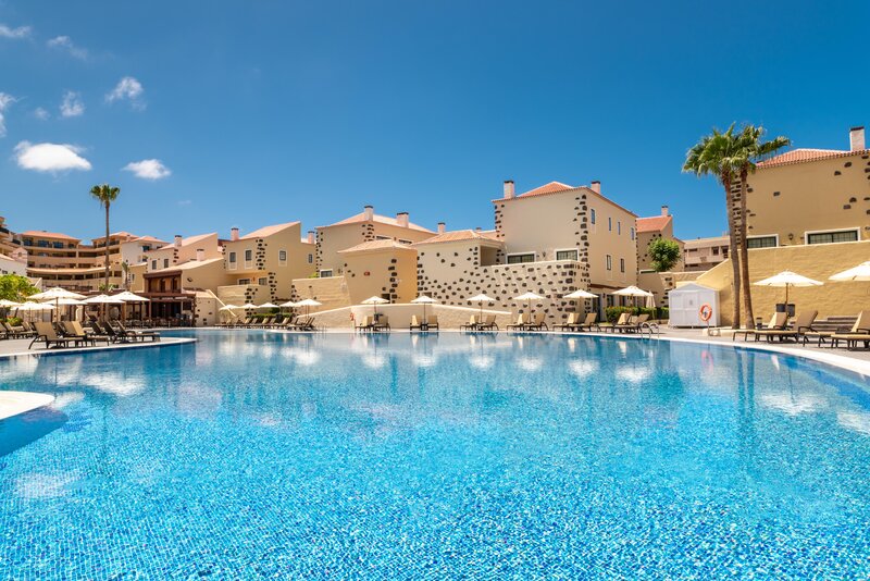 Swimming pool area at GF Isabel with blue sky overhead