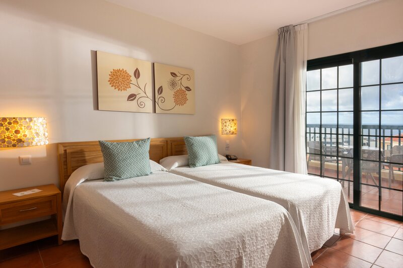 Twin beds in apartment accommodation at GF Isabel in Tenerife