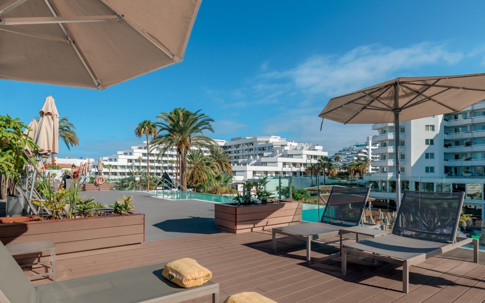 Parasols up over sun loungers on wooden decking at Spring Hotel Vulcano